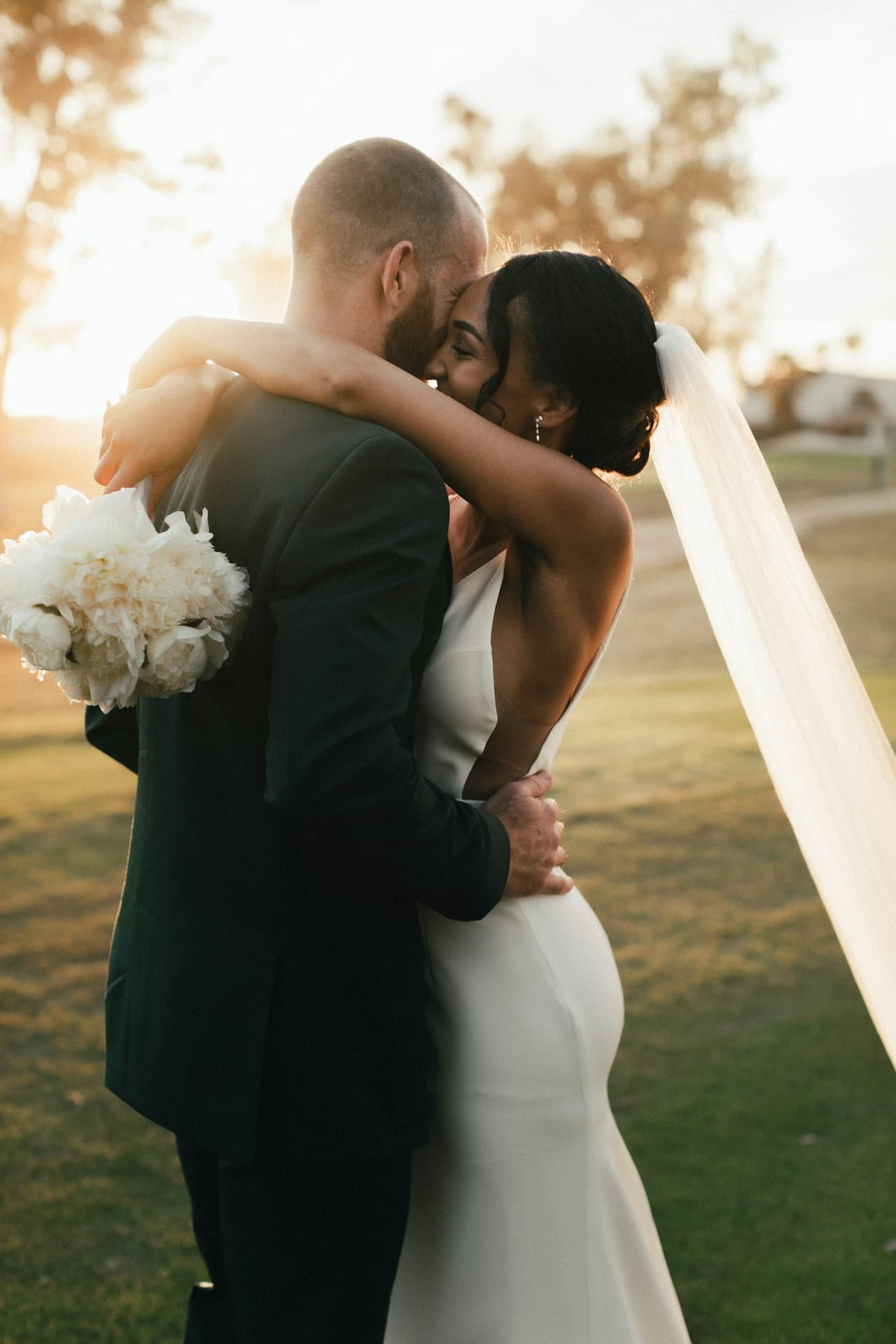 A bride and groom embracing on their wedding day