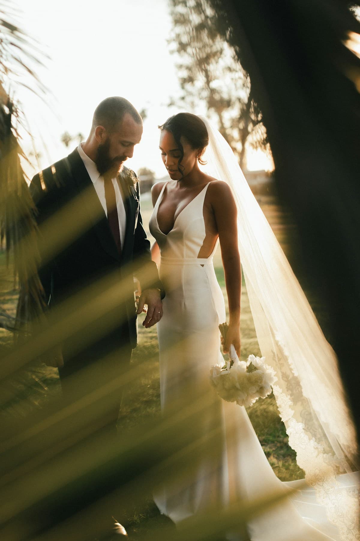 A bride and groom at sunset